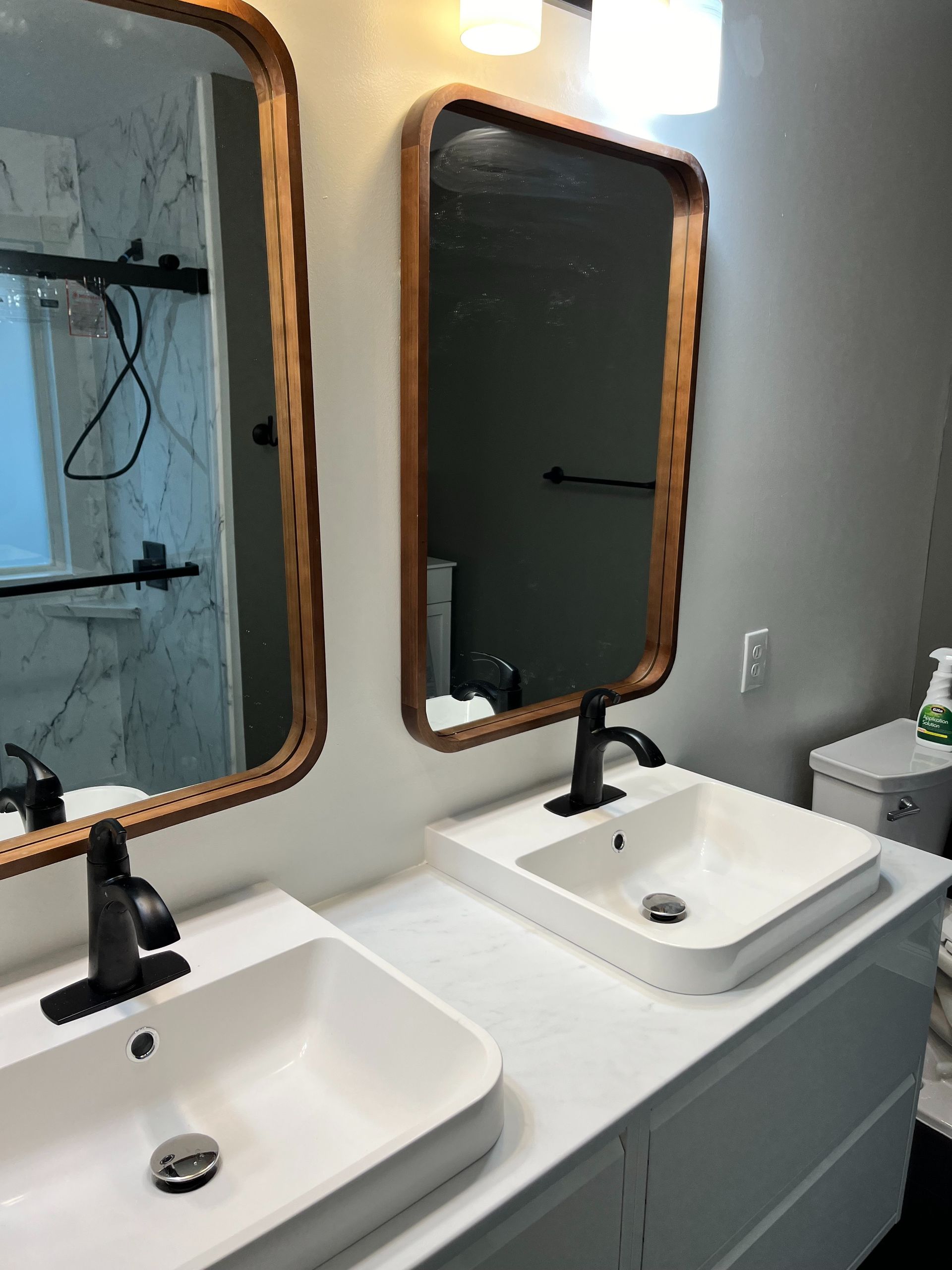 A bathroom with a tub , toilet and shower.