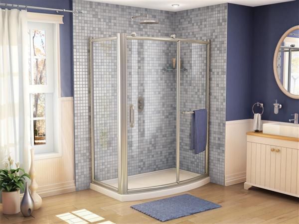 A bathroom with a walk in shower and a sink
