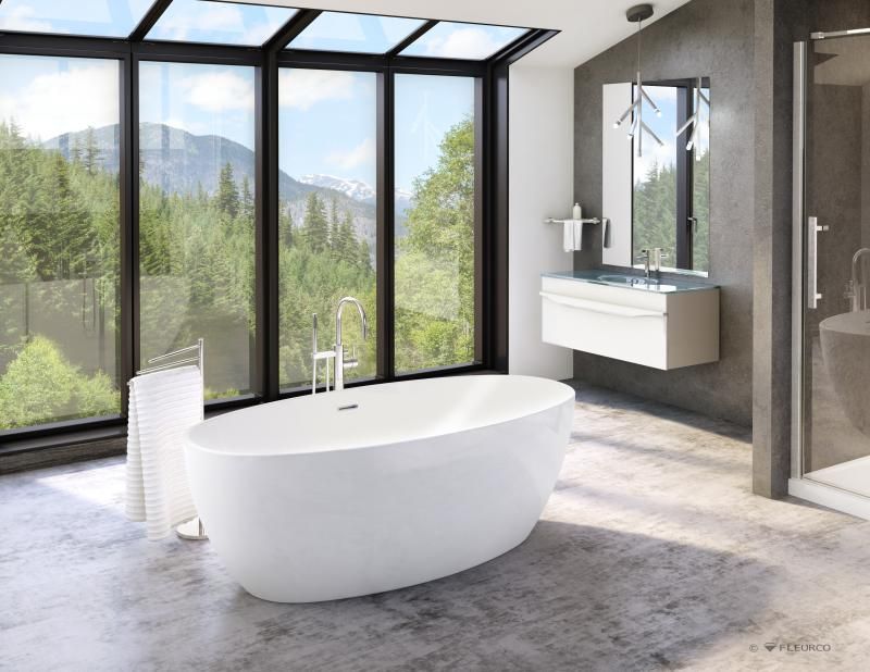 A bathroom with a bathtub , sink , mirror and large windows.