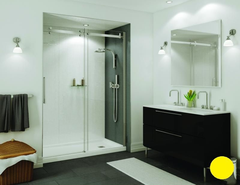 A bathroom with a sliding glass shower door