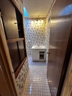 A bathroom with a toilet and sink in it
