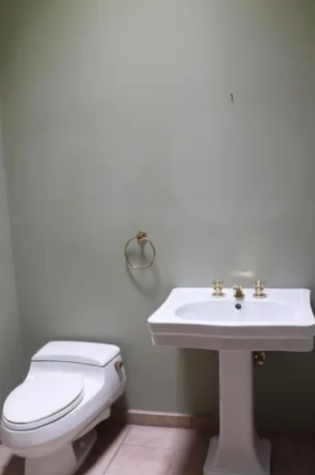 A bathroom with a toilet and sink in it