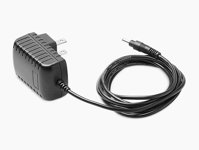 A power supply with a cord attached to it on a white background.