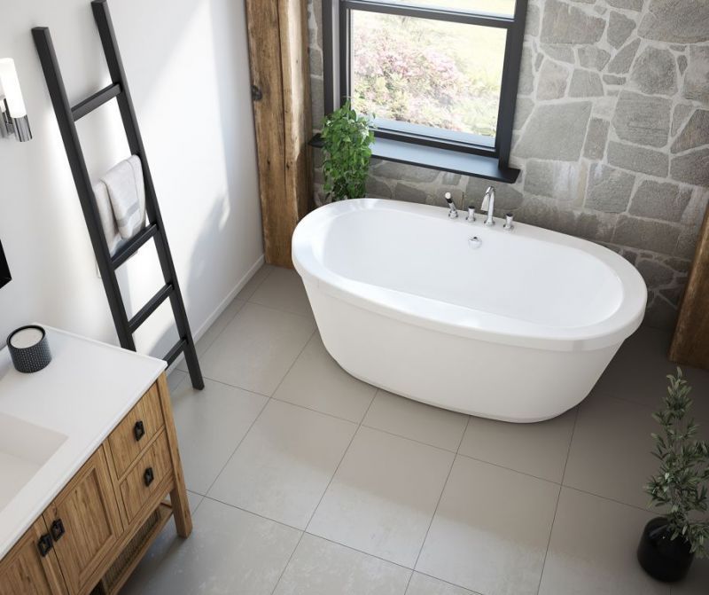 A bathroom with a bathtub , sink , and window