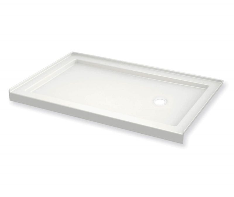 A white shower tray with a hole in the middle on a white background.