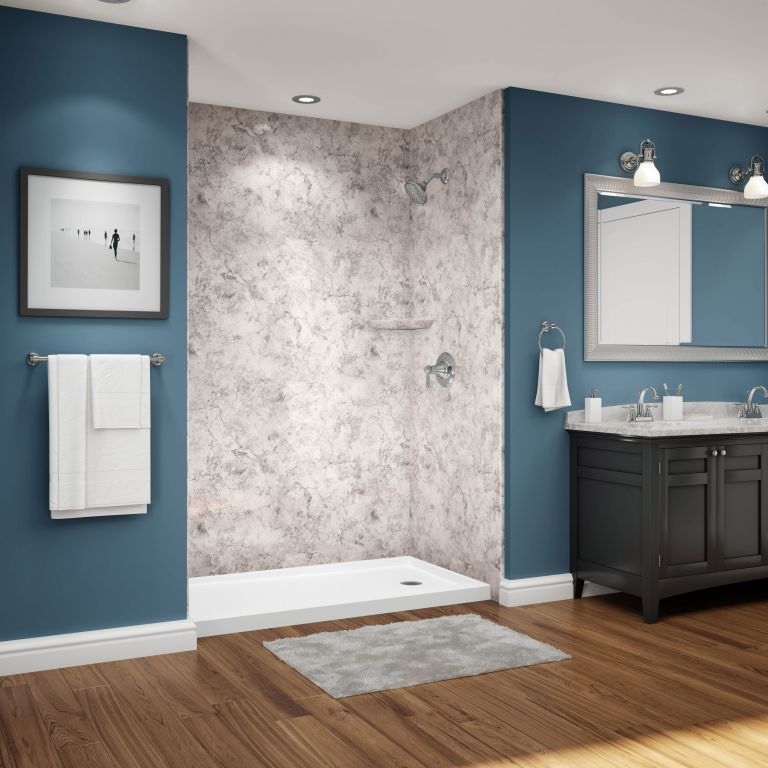 A bathroom with blue walls and a walk in shower