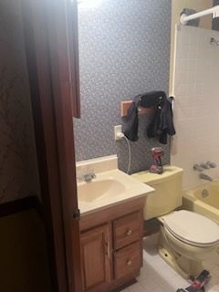 A bathtub is sitting in a bathroom under construction.
