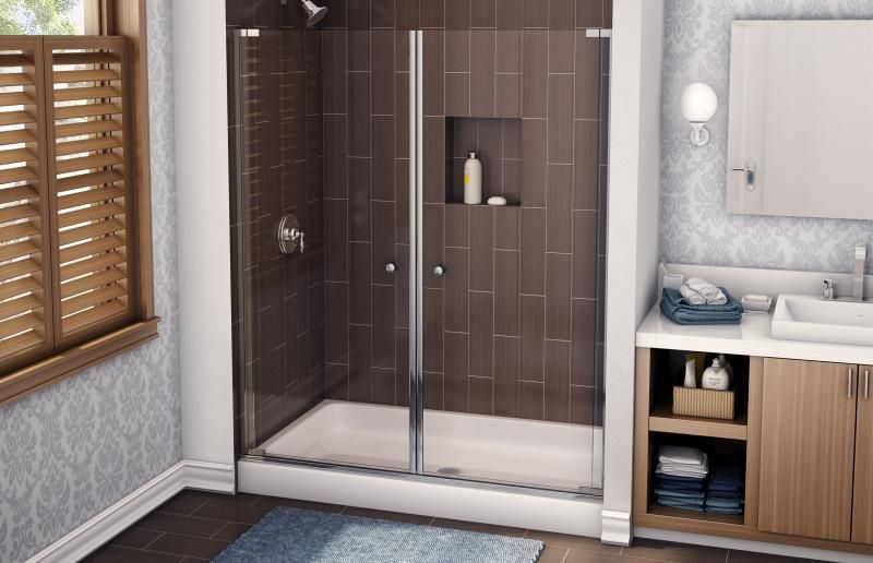 A bathroom with a walk in shower and a sink.