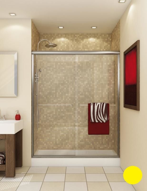A bathroom with a sliding glass shower door and a sink