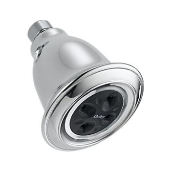 A close up of a shower head on a white background.