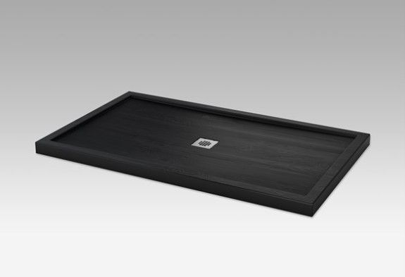 A black tray with a square on it is sitting on a white surface.