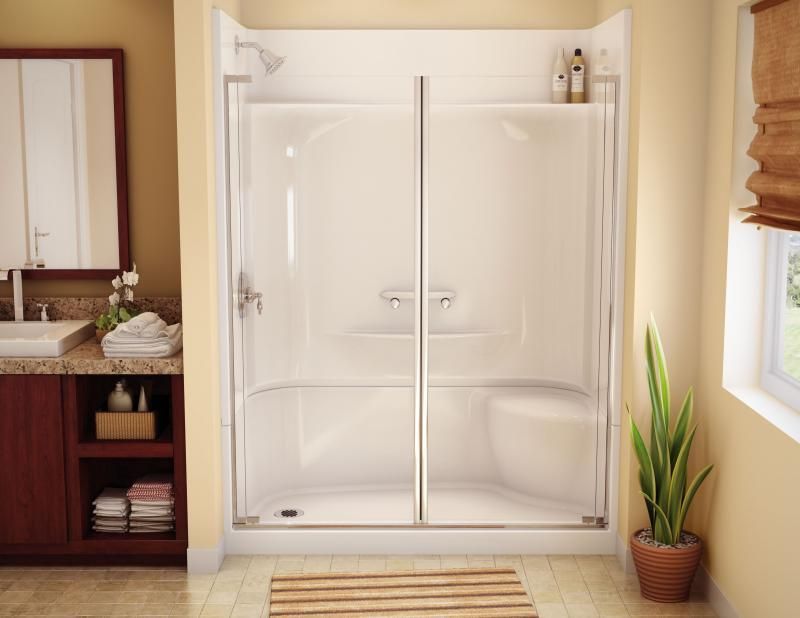 A bathroom with a walk in shower and a sink.