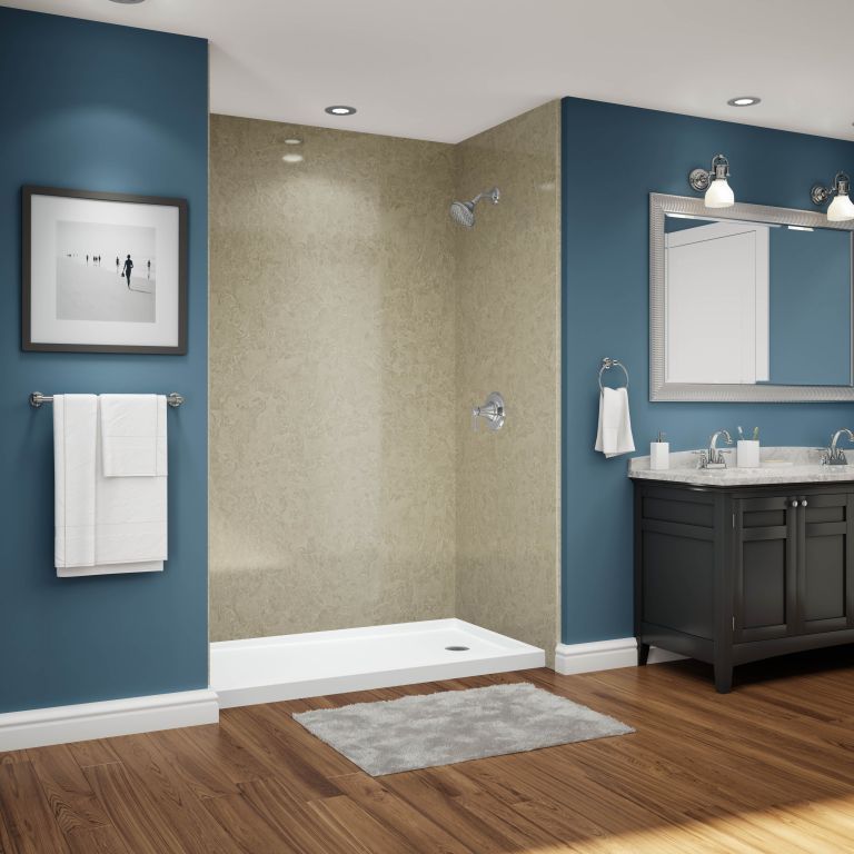 A bathroom with blue walls and a walk in shower