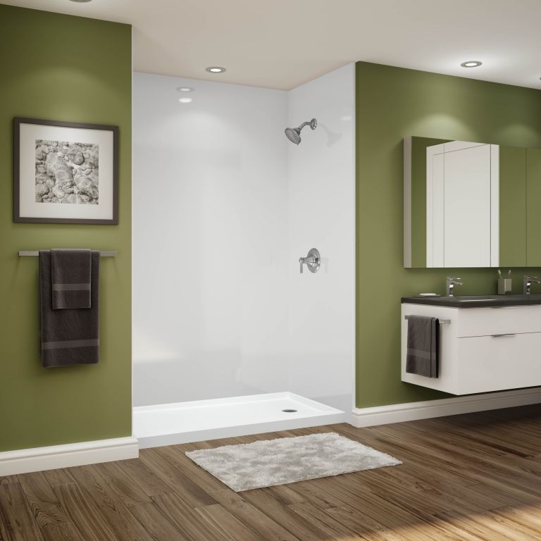 A bathroom with green walls and a walk in shower