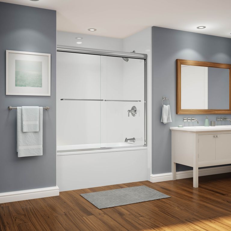 A bathroom with a bathtub a sink and a mirror