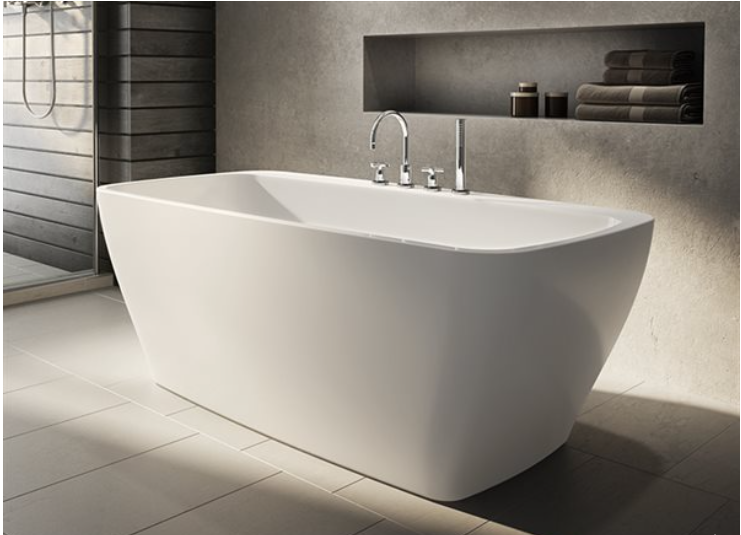 A white bathtub in a bathroom next to a shelf with towels on it