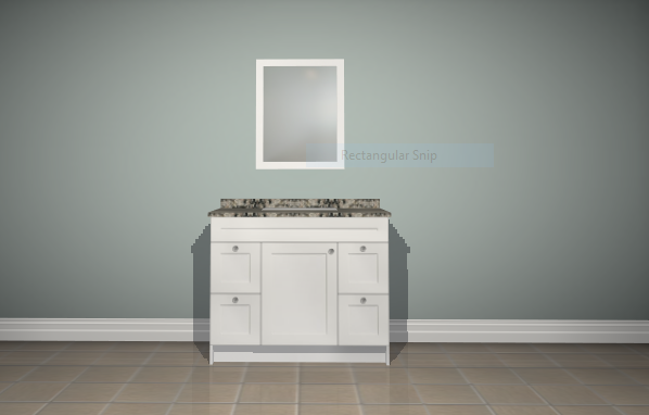 A bathroom vanity with a mirror above it