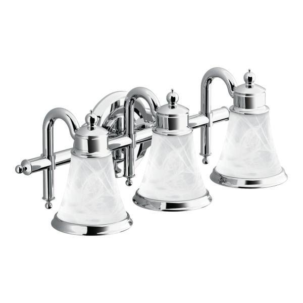 A chrome vanity light with three clear glass shades
