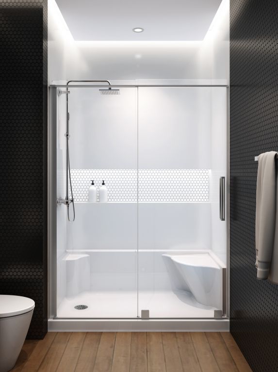 A bathroom with a sliding glass shower door
