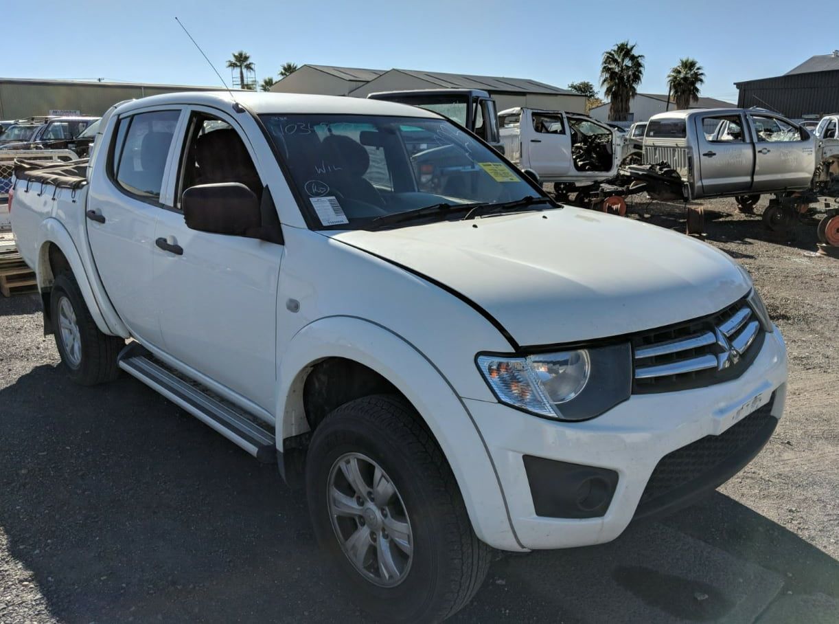 A White Pickup Truck Is Parked In A Lot — Scott's 4WD Parts Plus In Armidale, NSW