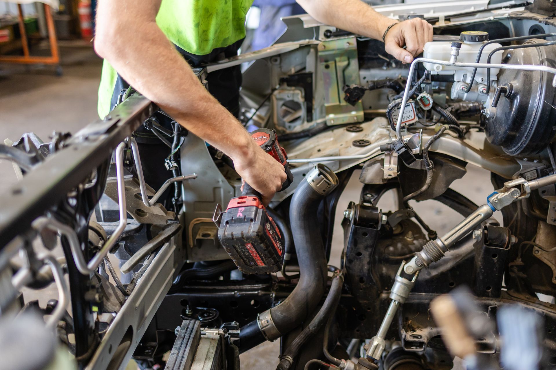A Man Dismantling  A Car Engine — Scott's 4WD Parts Plus In Dubbo, NSW