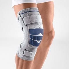 A person is wearing a knee brace on their leg.