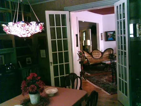 Dining Room With Flower Vase — Lancaster, NY — Sassafras Bed & Breakfast