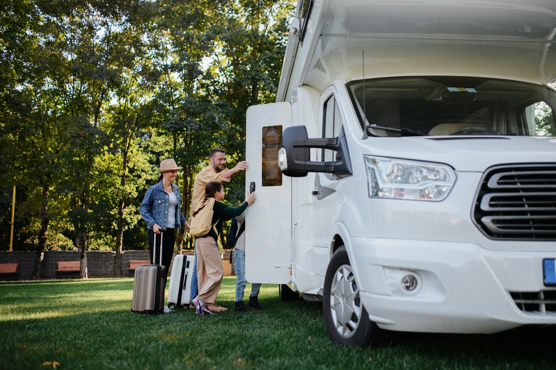 Couple standing outside their RV talking