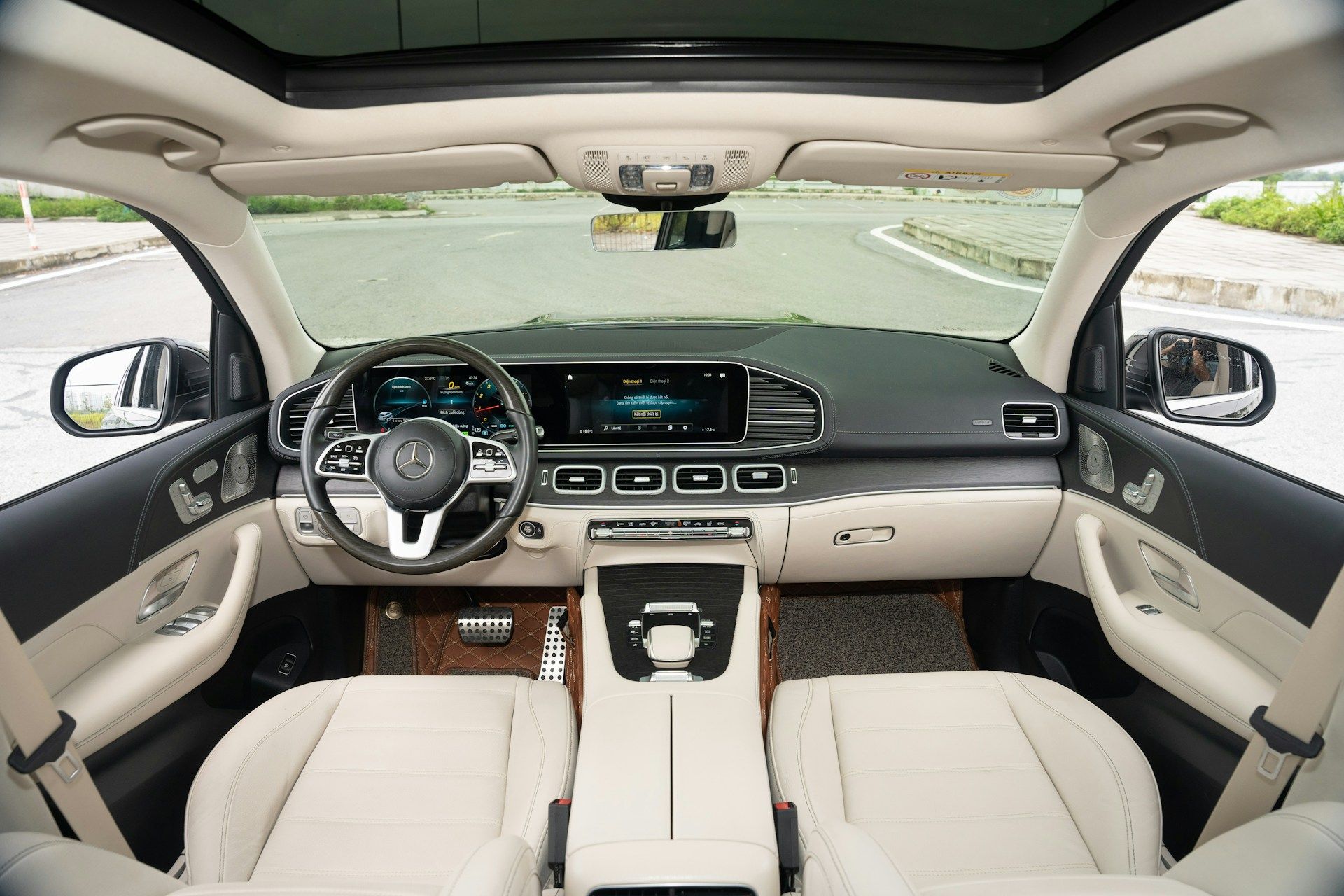 Luxury car interior view showing steering wheel and dashboard