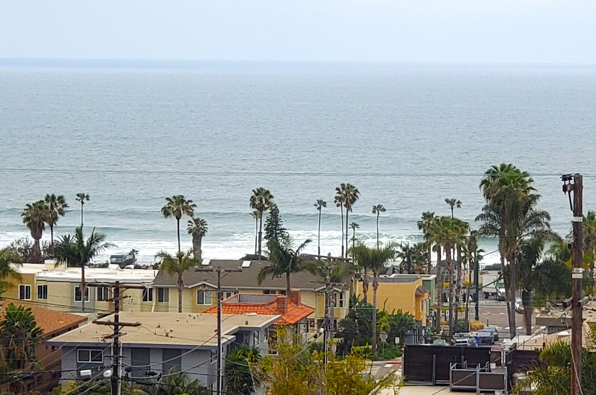 An aerial view of a residential area near the ocean