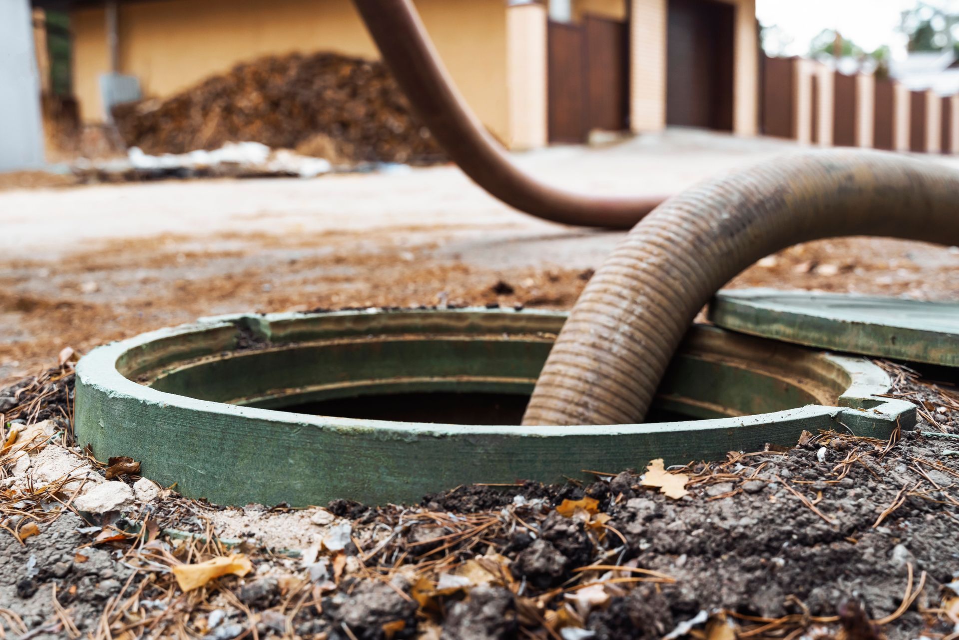A hose is connected to a septic tank.
