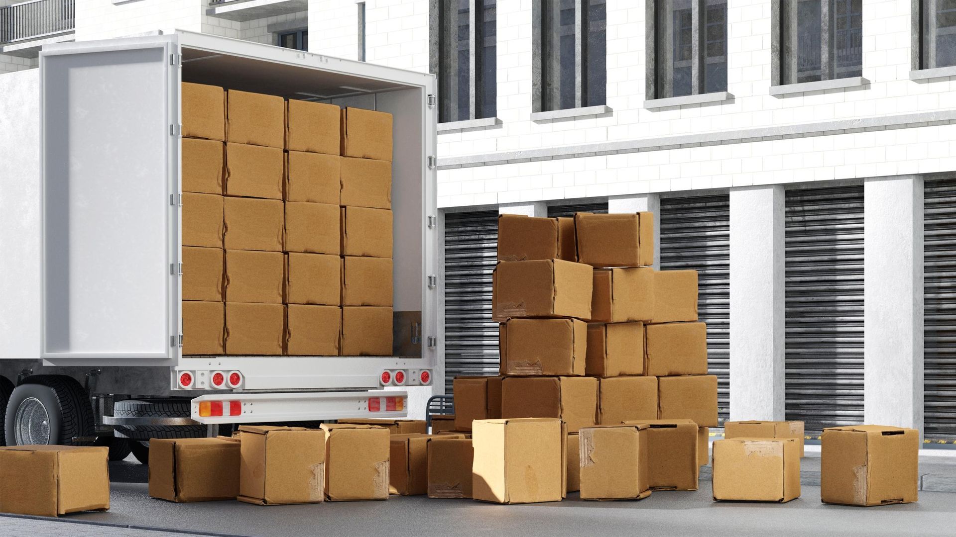 A delivery truck unloading cardboard boxes in front of a building.