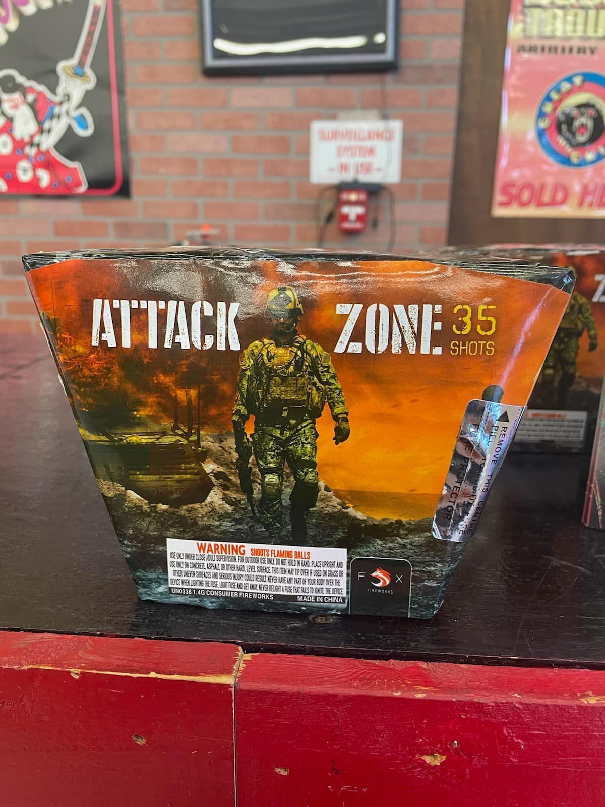 A box of fireworks with a soldier on it is sitting on a table.