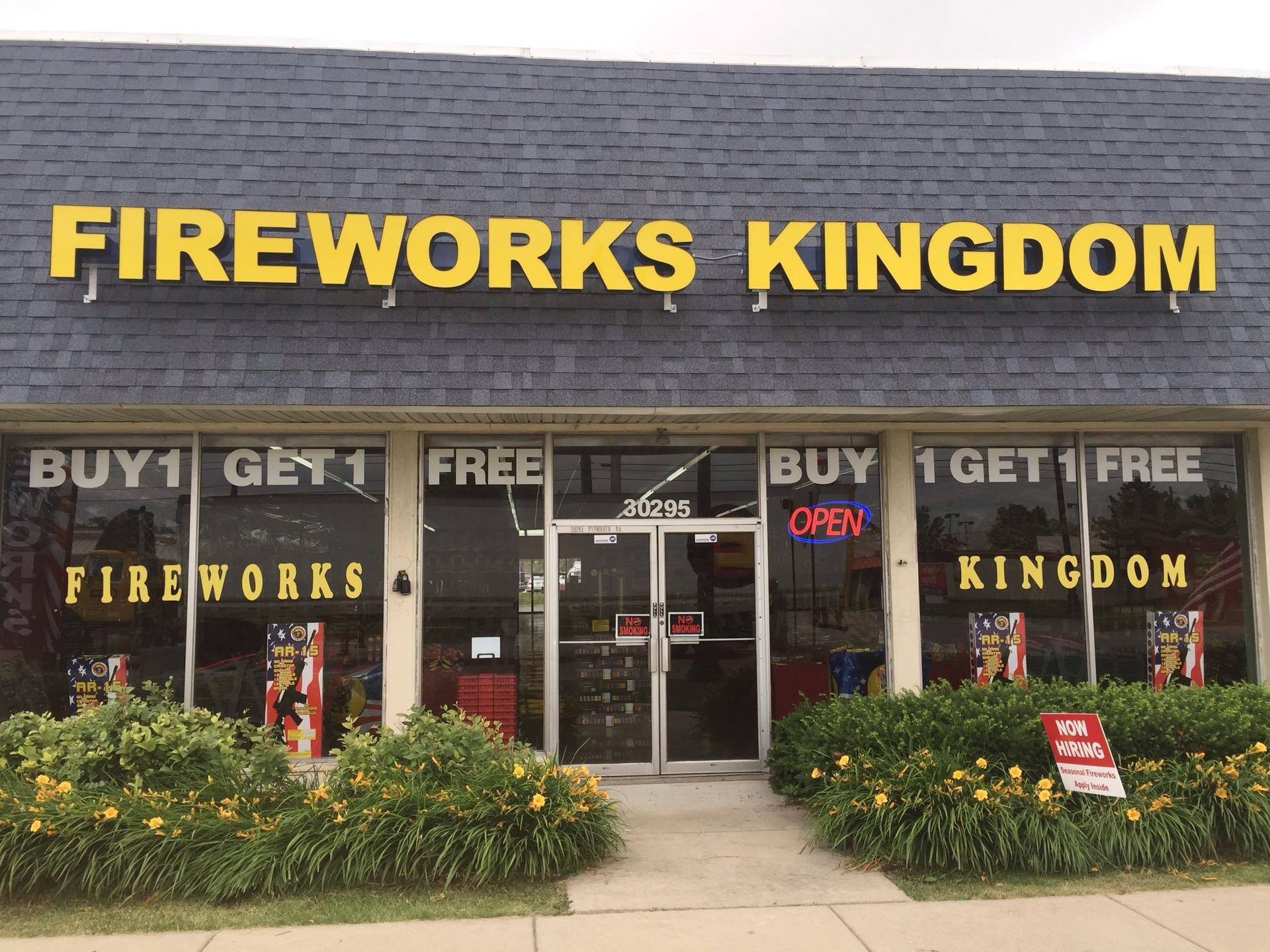 The front of a fireworks kingdom store with a sign that says buy 1 get 1 free fireworks