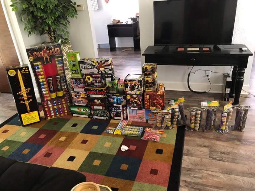 A living room filled with lots of fireworks and a television.