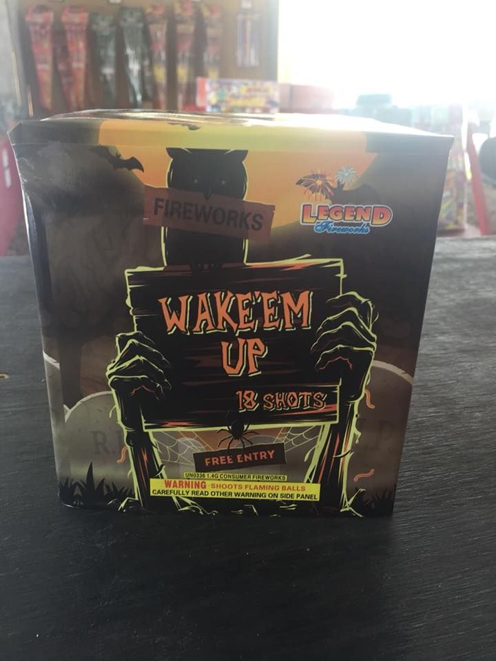 A box of wake em up fireworks is sitting on a table.