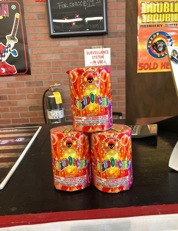 Three cans of fireworks are stacked on top of each other