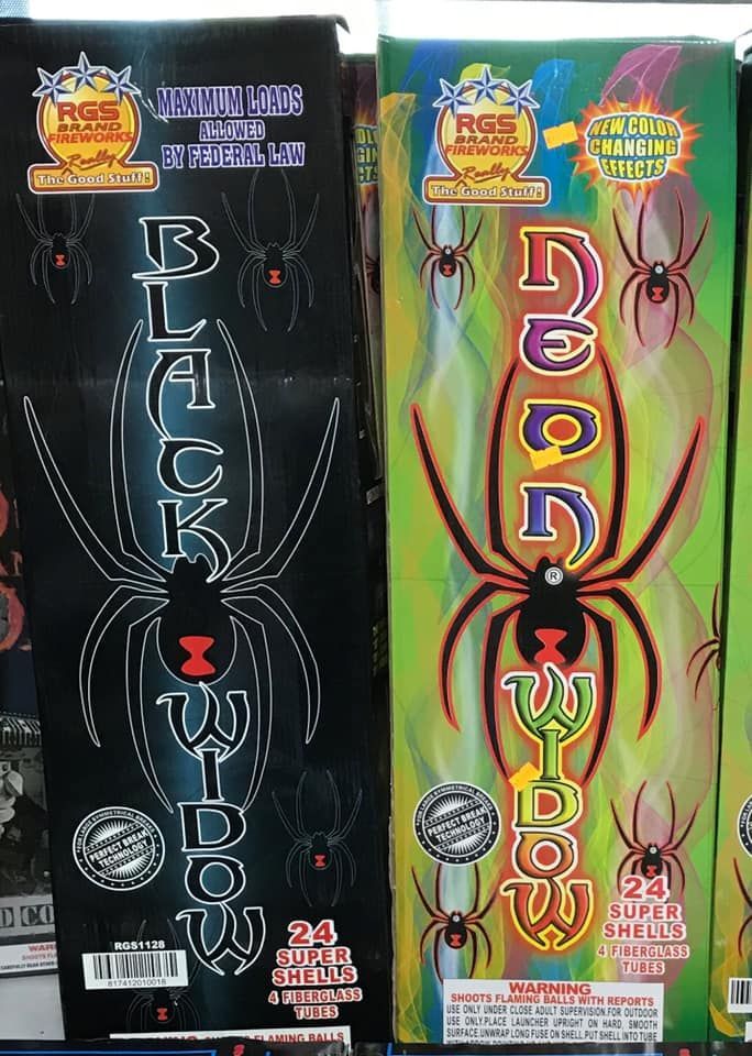 Two boxes of black widow fireworks are sitting next to each other
