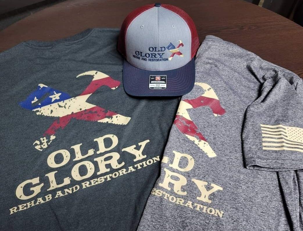 Two t-shirts and a hat with the