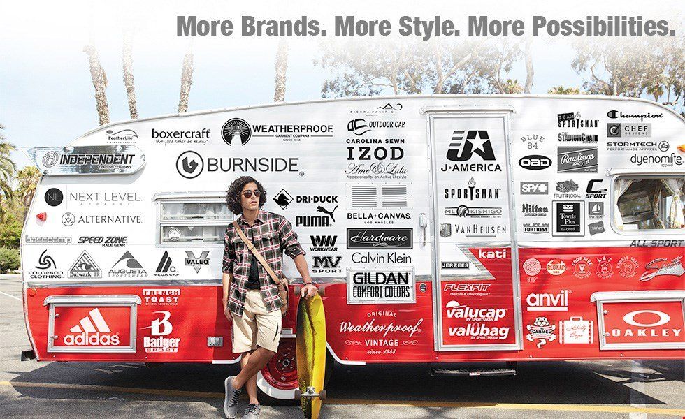 A person stands by a branded RV. The RV has numerous logos. The text reads: 