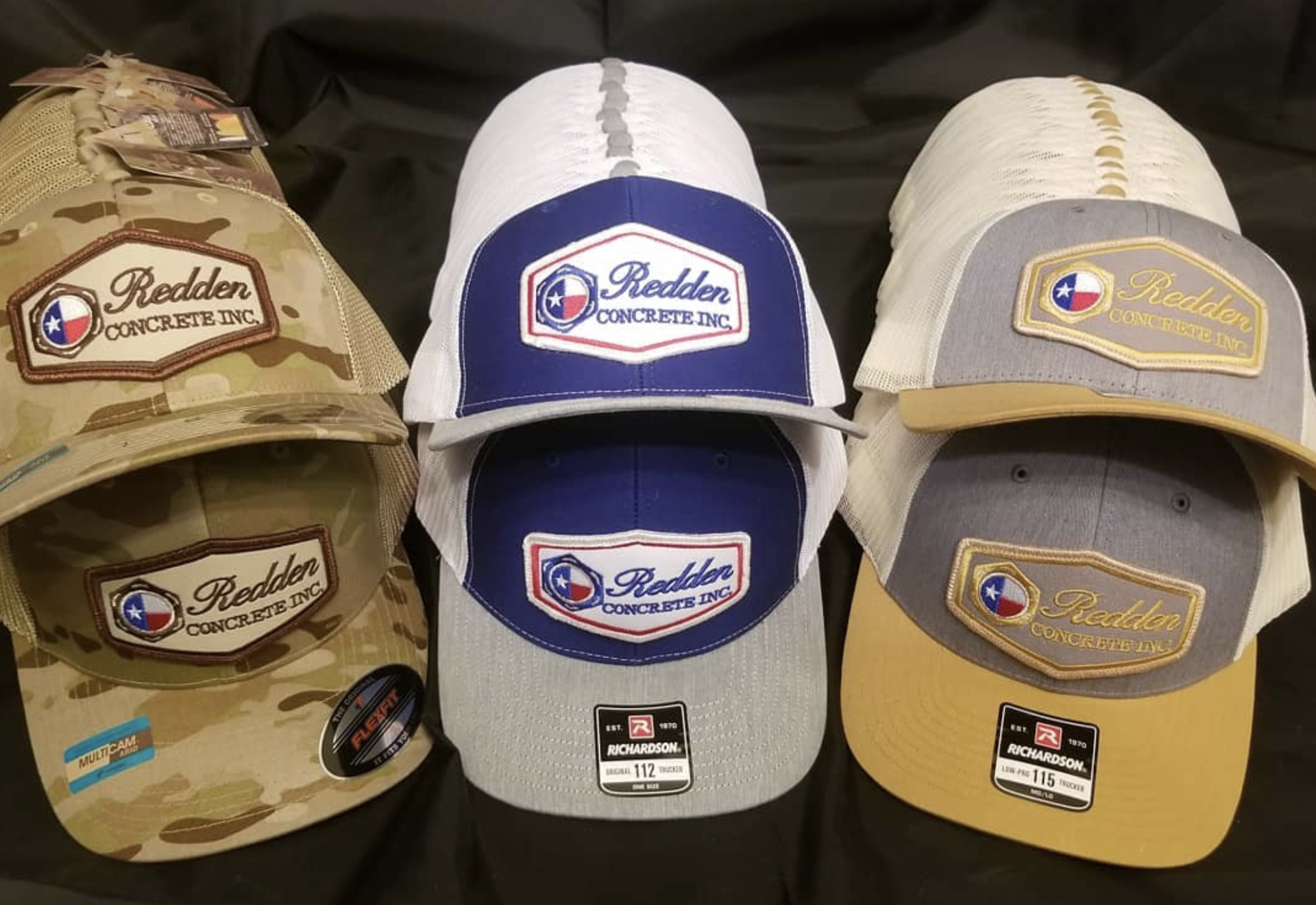 Three baseball caps with the 
