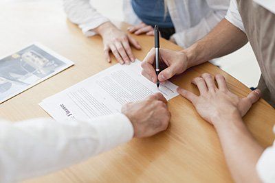 Couple Signing Contract — Bakersfield, CA — Valley Manufactured Homes, Inc.