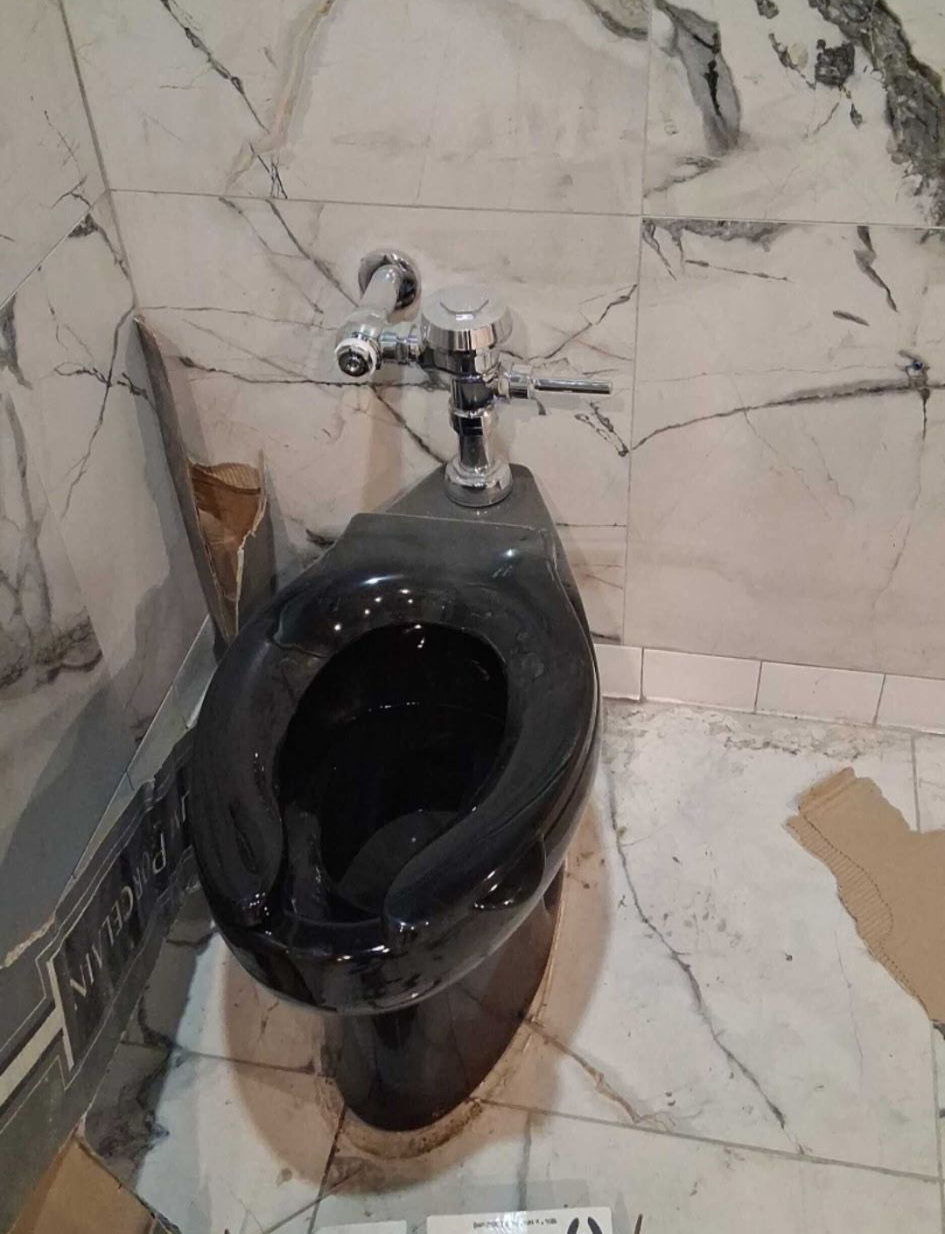Plumber fixing a kitchen faucet. 