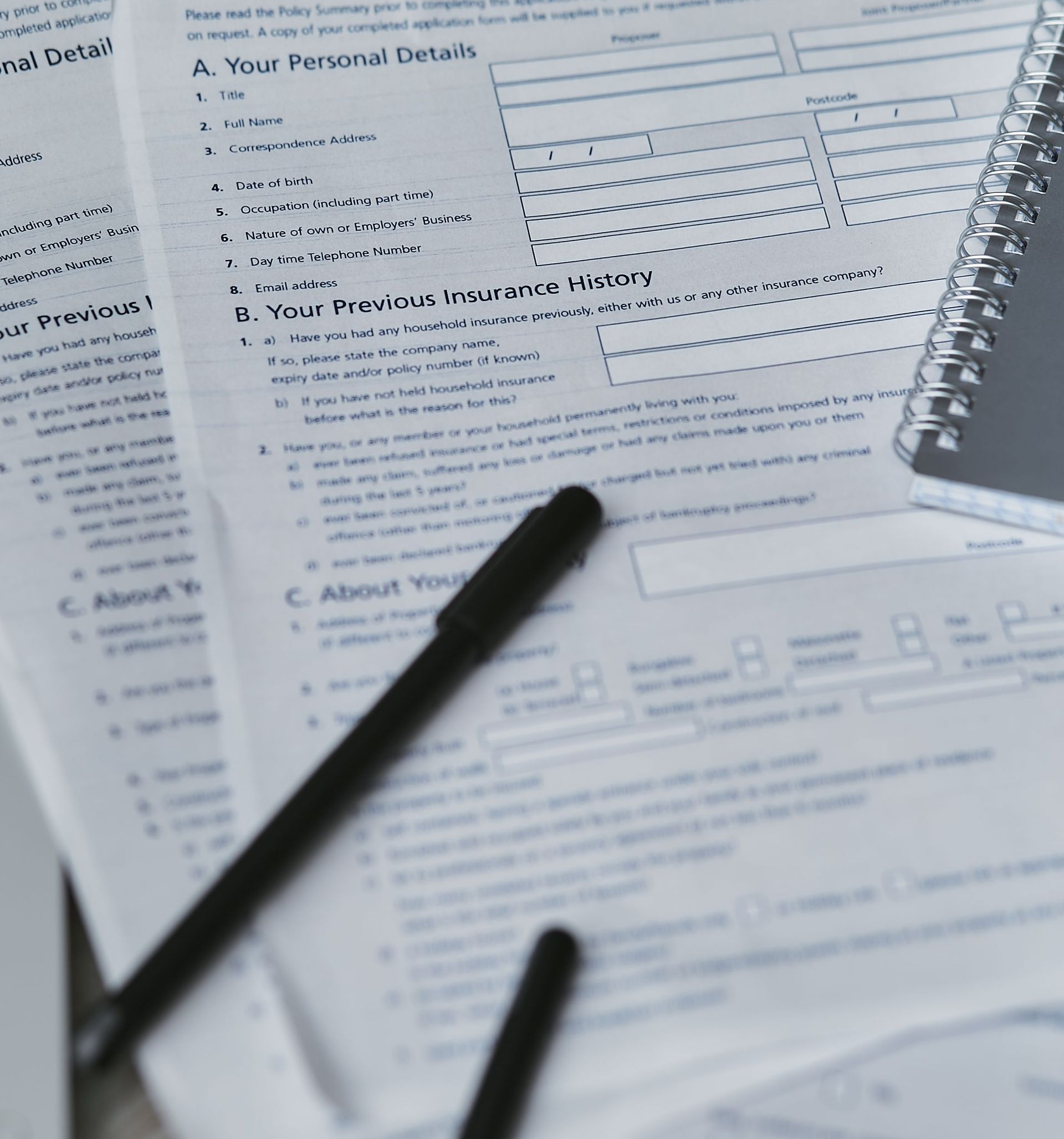 Hands signing documents at a desk with laptop and calculator in a business meeting collage