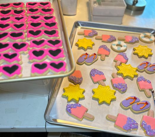 A cookie with skeleton hands making a heart shape