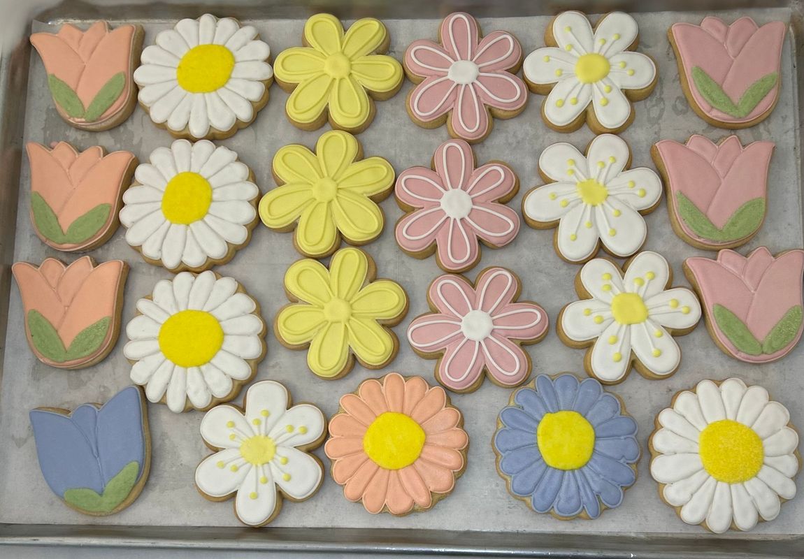 A tray of cookies decorated to look like pumpkins