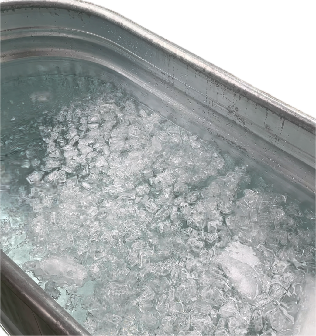 A silver metal tub filled with water and crushed ice.