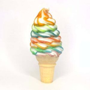 A rainbow colored ice cream cone on a white background