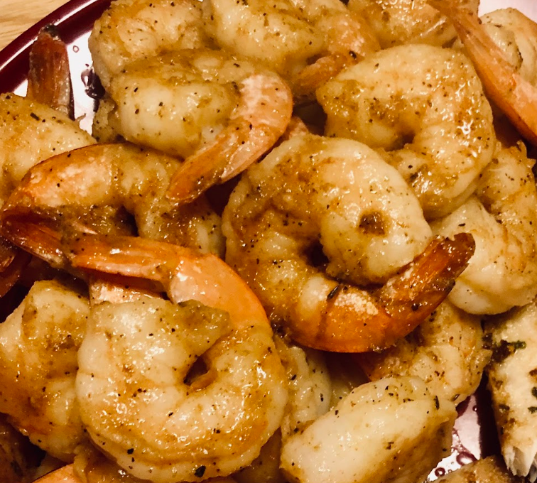 A close up of a plate of shrimp on a table