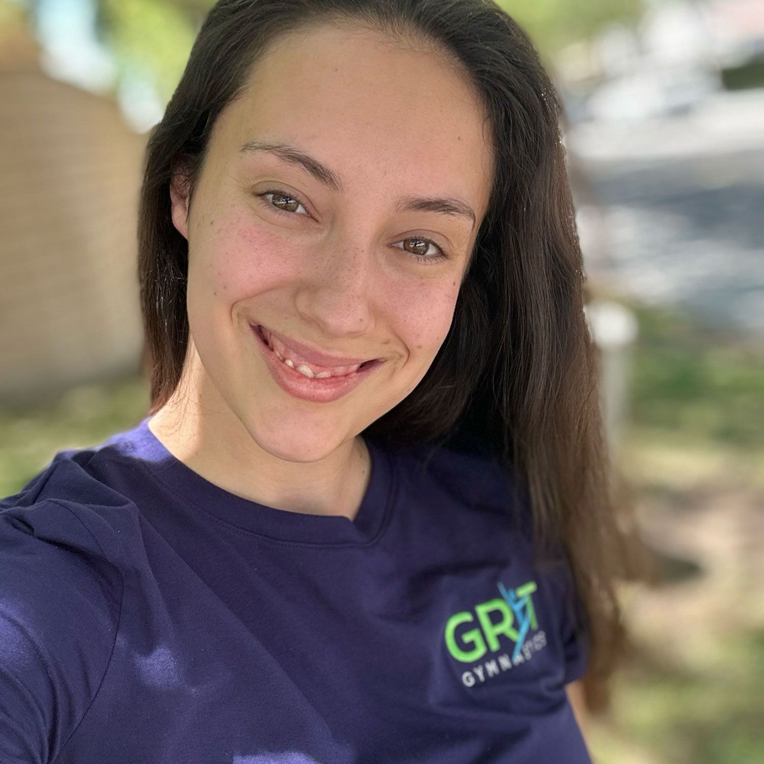 Woman smiling in a blue shirt with